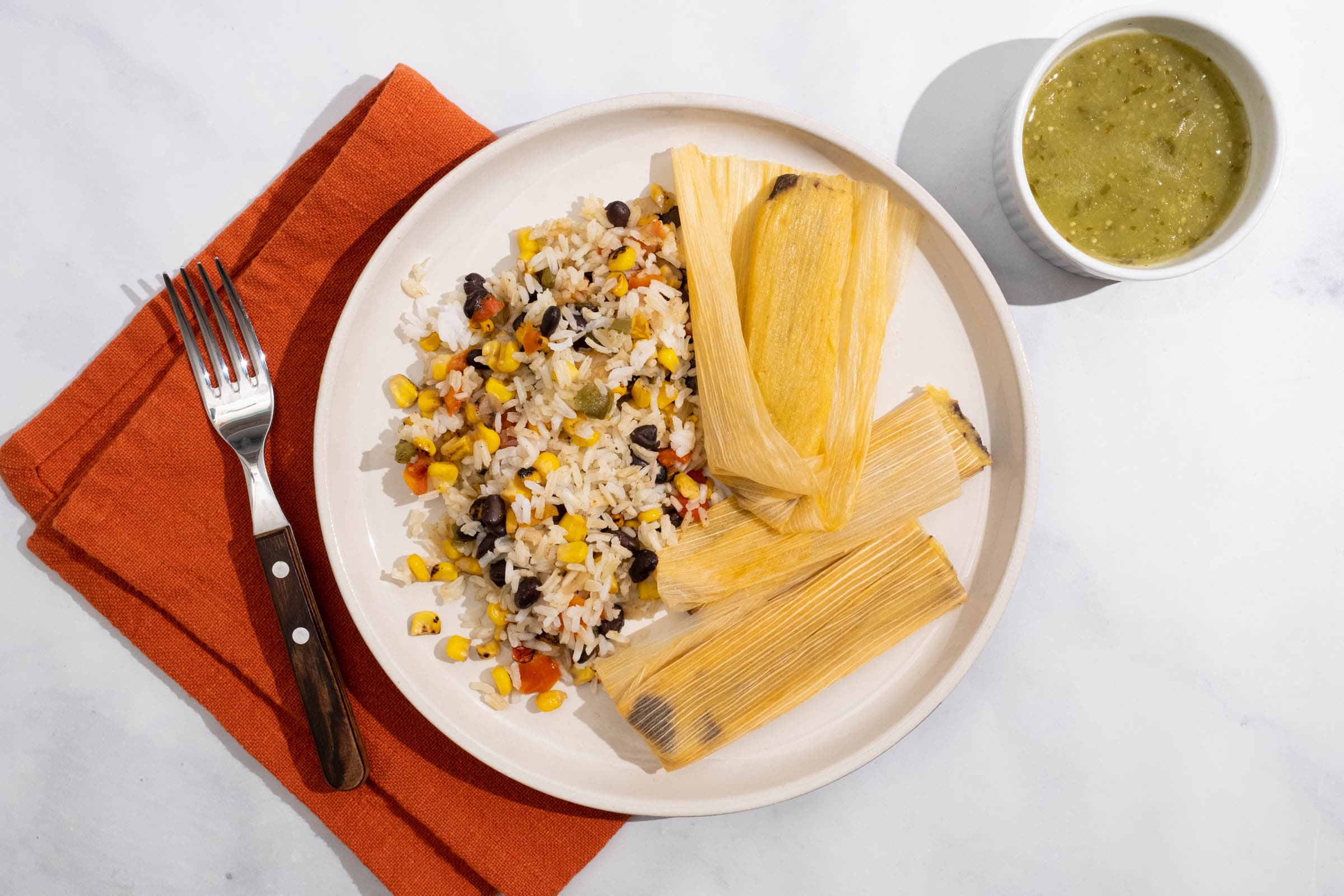Black Bean and Cheese Tamales with Southwest Rice and Tomatillo Sauce