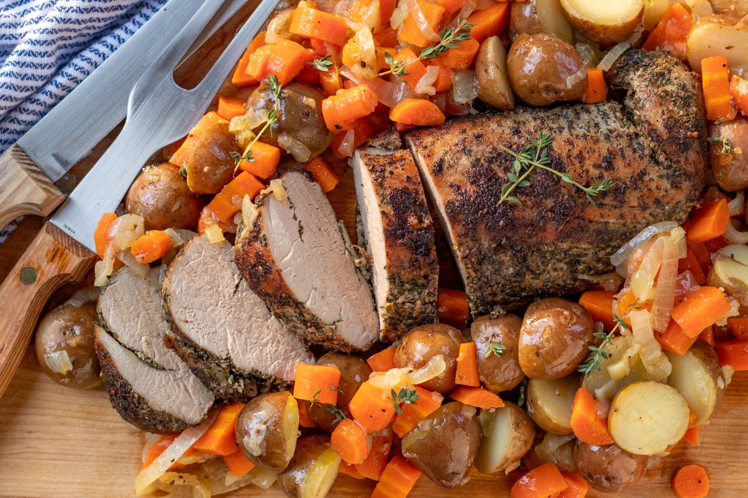 Herb Crusted Pork Tenderloin with Carrots, Onions, and Potatoes