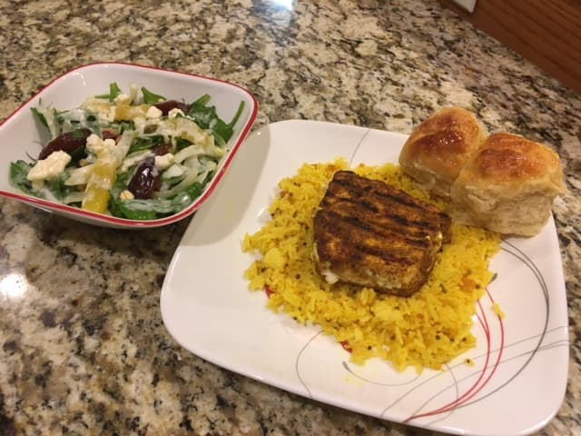 Omani Grilled Swordfish with Lemon Rice (Mashuai), Orange, Date, and Fennel Salad, and Honeycomb Bread (Khaliat Nahal)
