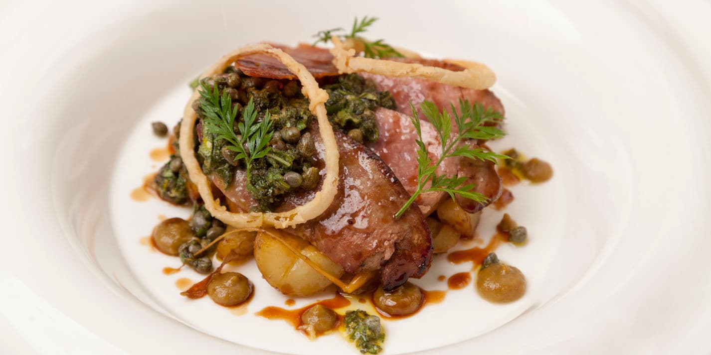 Calf's liver with sage salsa verde, caper, raisins, potatoes and crispy ham