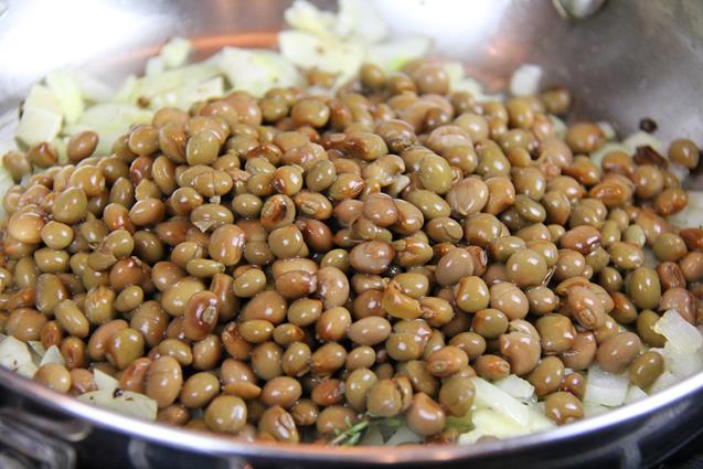 Pigeon peas added to the pan