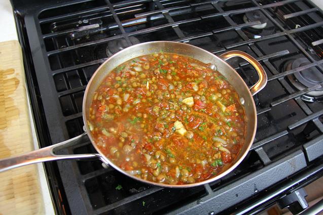 Pigeon peas and other ingredients boiling on the stove