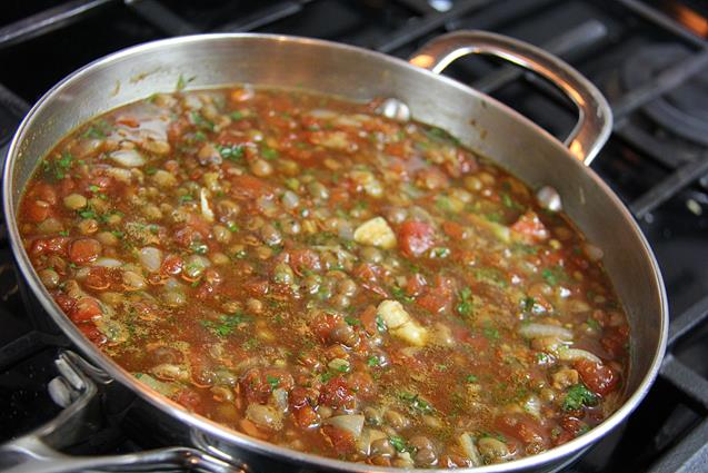 Stewed pigeon peas in a saucepan on the stove