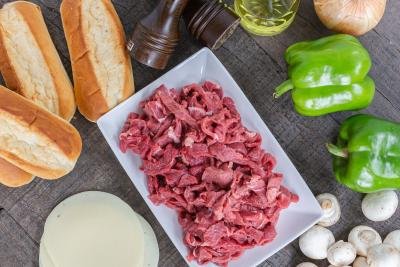 tray with all the ingredients for the philly cheesesteak