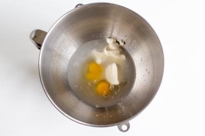 Mixing bowl with water and sour cream in a mixing bowl