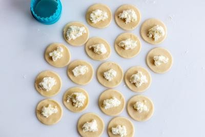 Pierogi dough rolled out with a filling