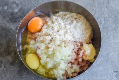 Meat, onion and eggs in a bowl