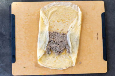 Crepe with meat filling and edges folded over.