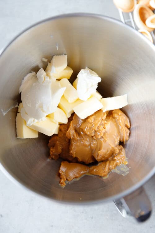 Ingredients for dulce de leche buttercream in a KitchenAid stand mixer bowl