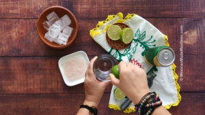 Rub the glass with a half of lime