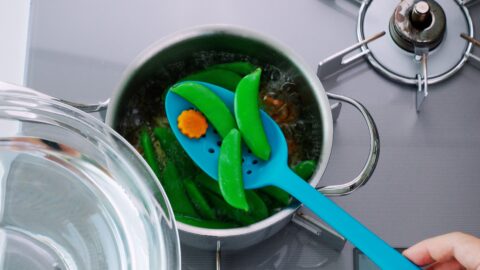 Boiled carrots and snap peas.