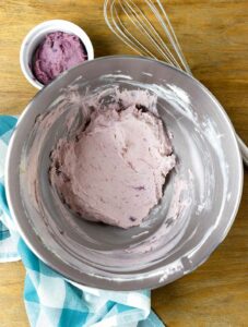 Ube halaya and cream cheese in a bowl.
