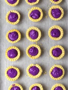 Ube filling on pre-baked tart shells.