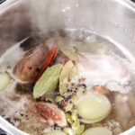 lamb shanks, water, onions, bay leaves, cardamom, black pepper, and salt in an instant pot