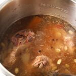 lamb shanks that have been pressure cooked along with broth and whole spices inside an instant pot
