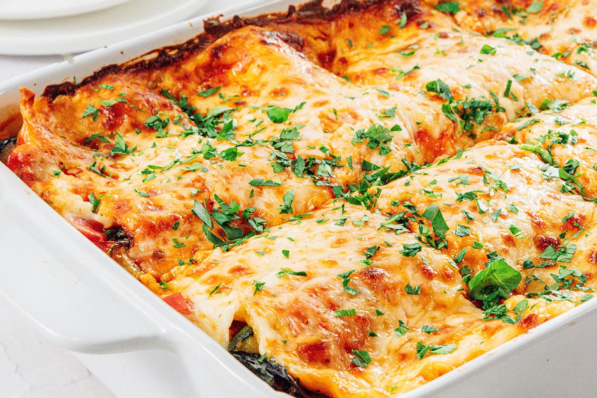 Vegetable lasagna in a casserole dish.