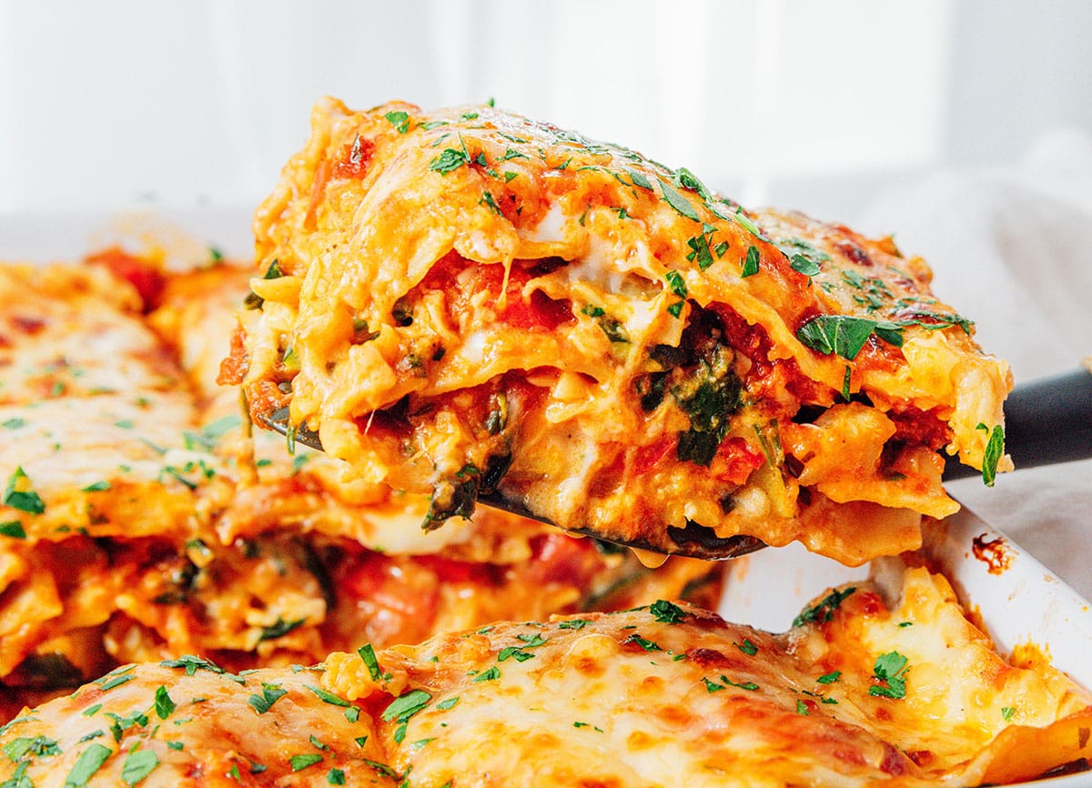 Vegetable lasagna on a serving spatula.