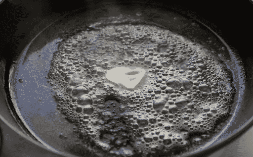 melted butter in a cast iron