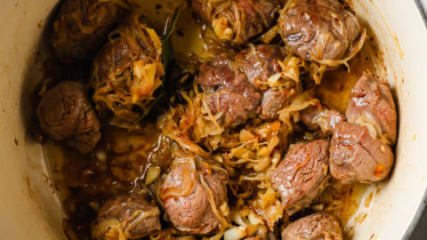 Beef Shanks seared with browned onions in a Dutch Oven