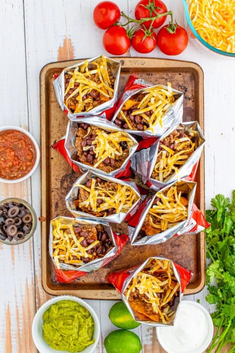 Cheese added on top of beans in bag.