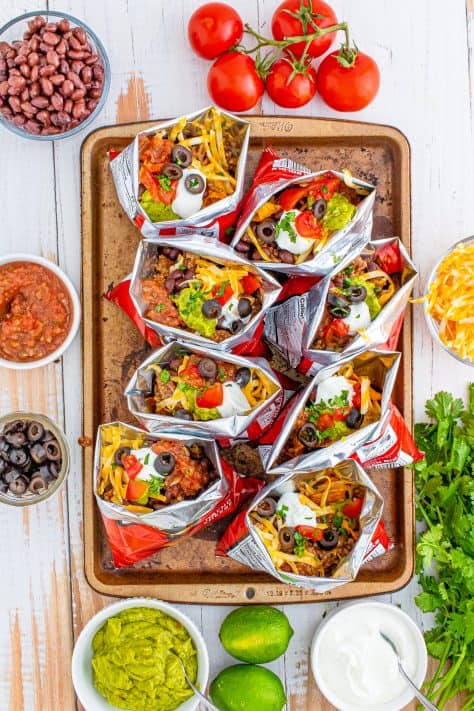 Favorite toppings added to bag of Doritos.